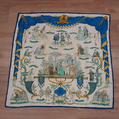 une image représentant une tapisserie bleue et blanche posée sur un parquet