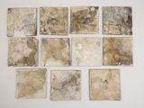 nine pieces of marble on a white surface
