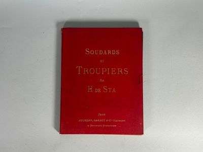 le livre rouge est posé sur une surface blanche