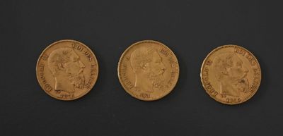 three gold sovereigns, one of which is a sovereign and one of which is a sovereign