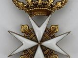 a close up of a gold and white star with a crown on it