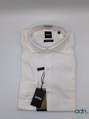 a close up of a white shirt with a tag on it