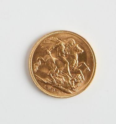 une pièce d'or sur laquelle est représenté un homme à cheval