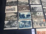 many old photographs of people and buildings on display
