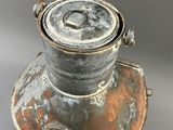 a metal container that has a lid on it
