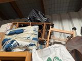 a pile of clothes and other items on the floor