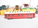 several toy trains are lined up on a white surface
