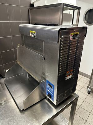 a machine that is sitting on a table in a kitchen