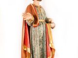 statue of a man with a beard wearing a robe and a robe around his neck