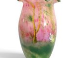 a vase that has a pink and green design on it