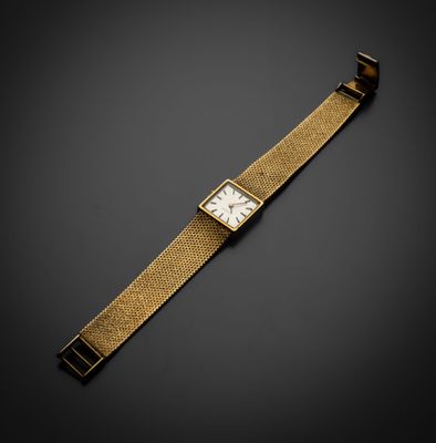 une montre-bracelet en or 18 carats avec un cadran blanc