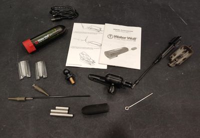 the contents of a bicycle repair kit laid out on a table