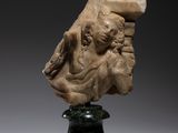 a marble head of a woman on a pedestal