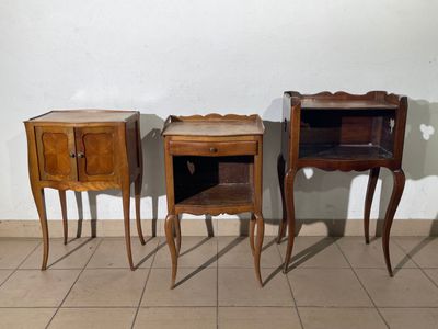 three pieces of furniture are sitting on a tiled floor next to a wall