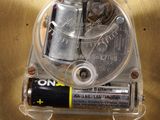 a battery and a battery holder in a metal container