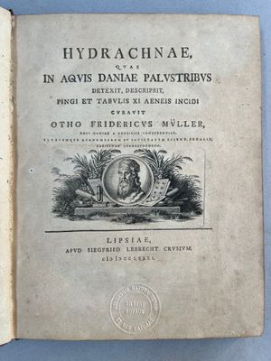 an old book with a picture of a man and a woman on it