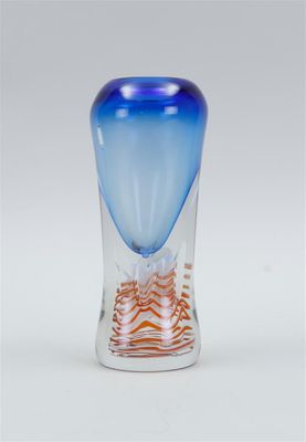 a glass vase with a blue and orange design on it