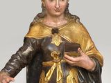 an image of a statue of jesus holding a cross in his hands