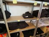 a lot of clothes on the shelves in the room