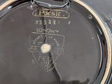 a close up of a drum with a sticker on the side of it
