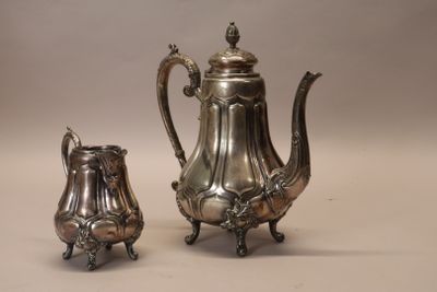 silver plated coffee pot and sugar shaker on stand
