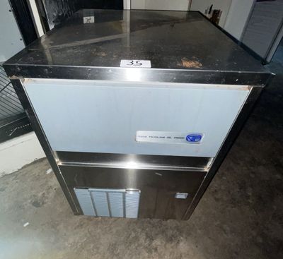 an image of a kitchen with a refrigerator and a counter top