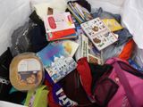 a white bag full of books and other items in it