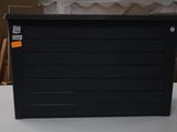 a black box sitting on top of a white table