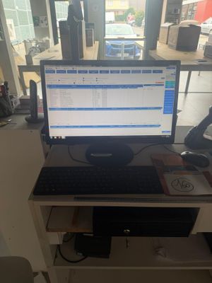 a desk with a computer monitor and a keyboard on it