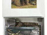 a box with a toy gun and a gun in it