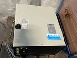 an image of a metal box sitting on top of a wooden pallet