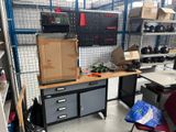 a work area with a lot of boxes on the table