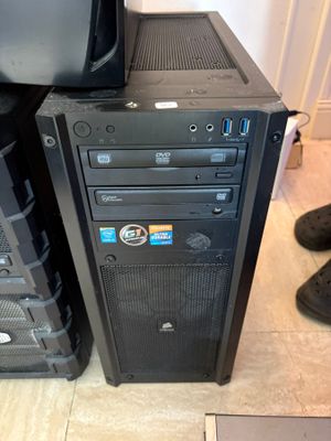 a black computer tower with a monitor on top of it