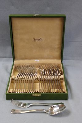 a green box with a set of silverware in it
