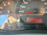 a close up of a car dashboard with a speedometer