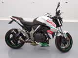 a picture of a white and red motorcycle parked in a room