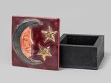 a close up of a box with a moon and stars on it