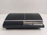 the sony playstation is sitting on top of a white table