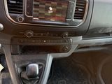 the interior of a car with a dashboard and steering controls