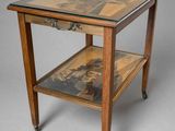 an image of a table with a glass top on wheels