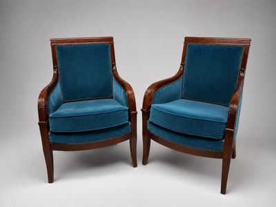 pair of blue upholstered armchairs