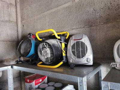 many different types of portable heaters on a shelf