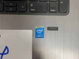 laptop computer with a sticker on it sitting on a desk
