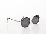 sunglasses on a white surface with a white background