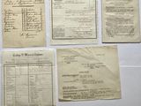 several old papers are sitting on a table with a calculator and a calculator
