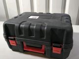 a close up of a black and red case on a white table