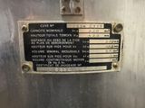 a sign on the side of a stainless steel tank