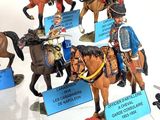 many figurines of soldiers on display in a display case