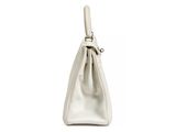 a white purse with a handle on a white background