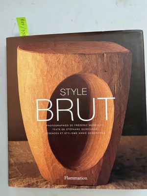 the book style brut by flammarion is on a table
